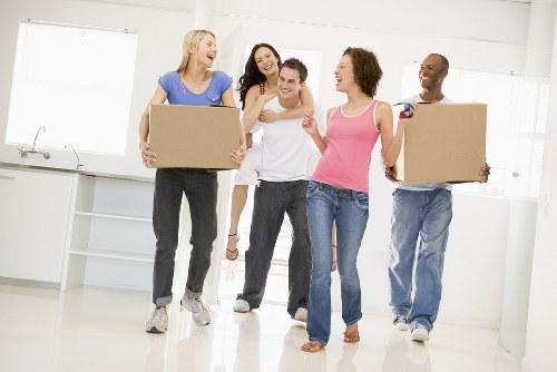People organizing belongings with Westhampstead storage in a compact urban home