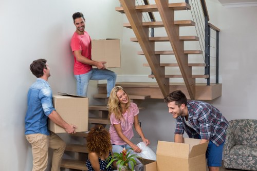 Professional flat removals team preparing boxes in Westhampstead