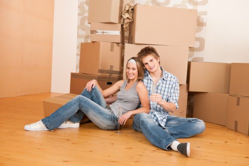 Professional house removals planning in West Hampstead with moving boxes and a removal van